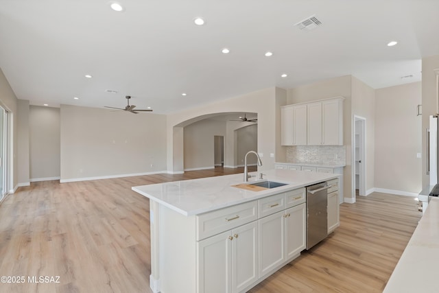 67620 E Lauren Pl, Oracle, AZ 85623 - kitchen featuring a ceiling fan, a sink, stainless steel dishwasher, arched walkways, and recessed lighting