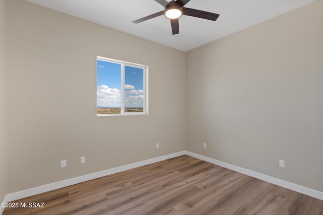 67620 E Lauren Pl, Oracle, AZ 85623 - unfurnished room with ceiling fan, wood finished floors, and baseboards