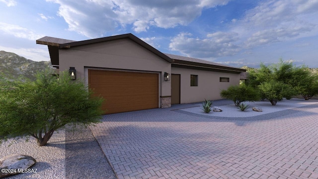 view of front of house featuring a mountain view and a garage