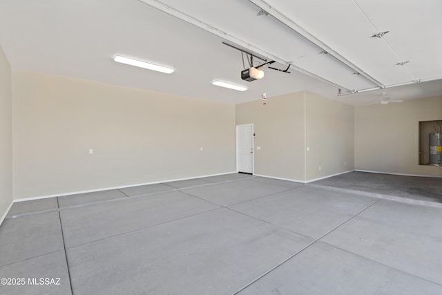 67620 E Lauren Pl, Oracle, AZ 85623 - garage with a garage door opener, electric water heater, and baseboards