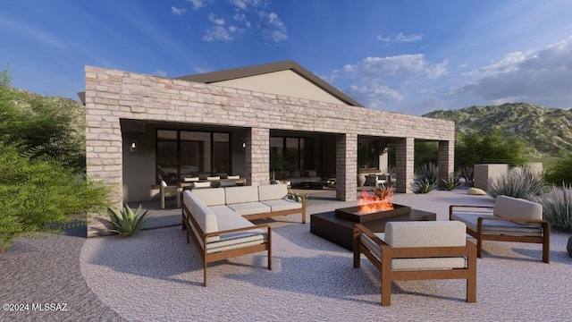 view of patio / terrace with an outdoor living space with a fire pit and a mountain view