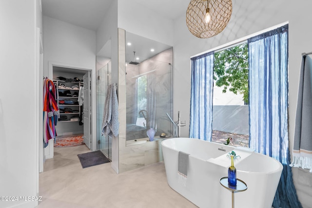 bathroom with shower with separate bathtub