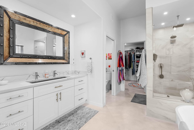 bathroom featuring toilet, vanity, an enclosed shower, and concrete flooring