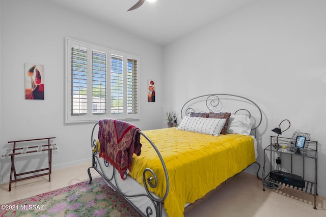 bedroom with light colored carpet and ceiling fan