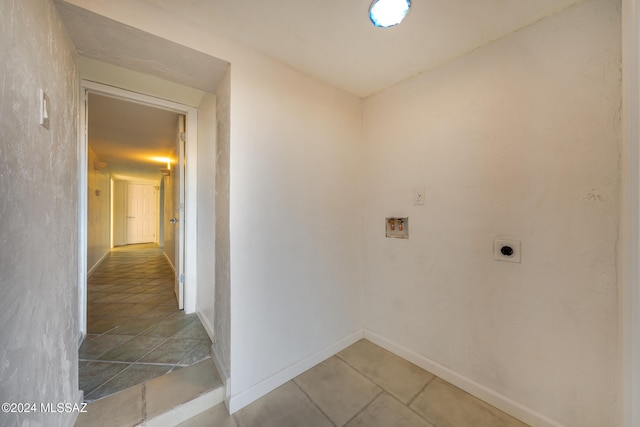 laundry area featuring tile patterned flooring, washer hookup, and electric dryer hookup