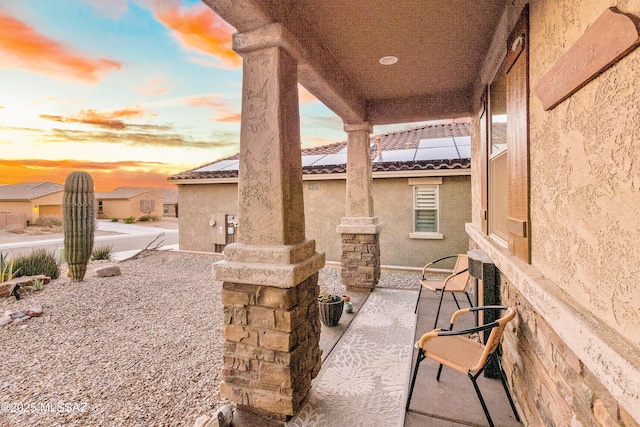 view of patio terrace at dusk