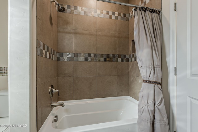 bathroom with shower / bath combination with curtain