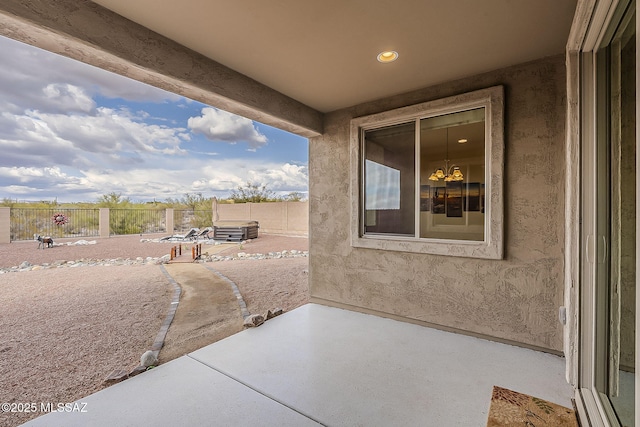 view of patio featuring fence