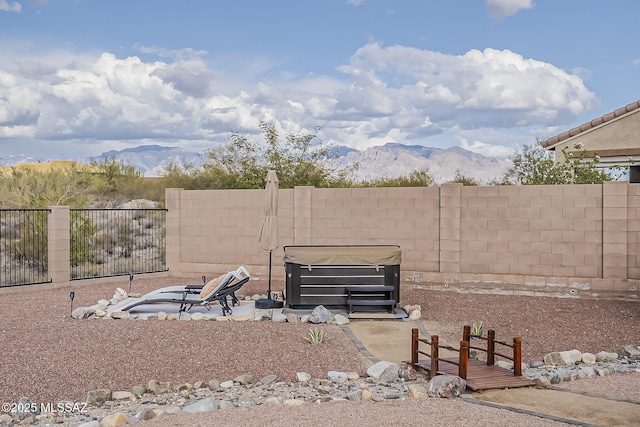 view of yard with a mountain view and a fenced backyard