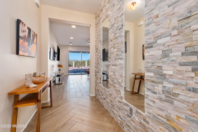 hall featuring parquet flooring and recessed lighting