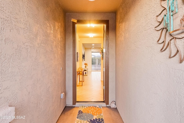 entrance to property featuring stucco siding