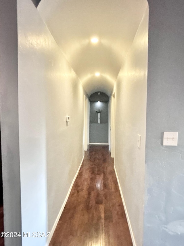 hallway with dark wood-type flooring