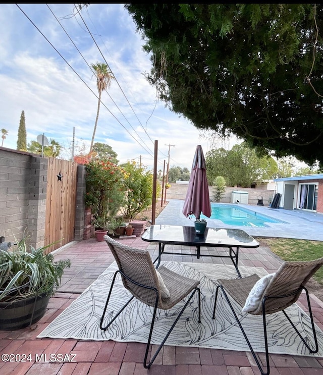 view of patio featuring a fenced in pool