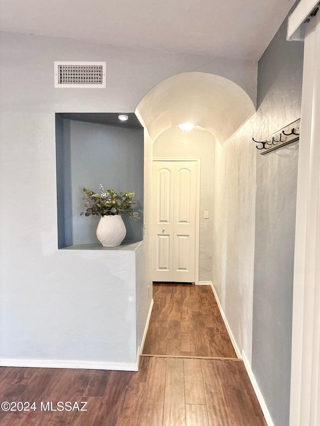 hallway featuring dark hardwood / wood-style floors