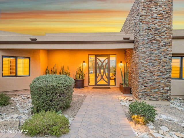 exterior entry at dusk with french doors