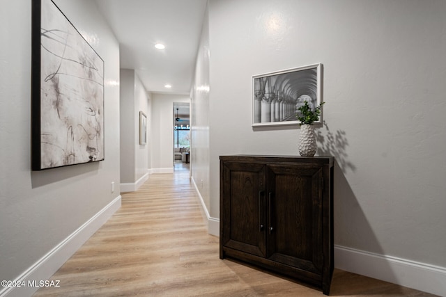 hallway with light wood-type flooring