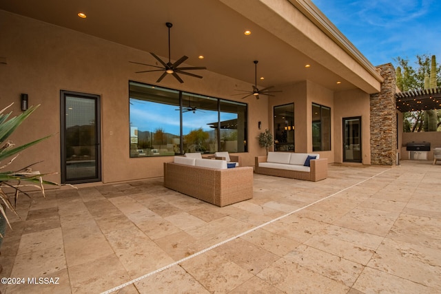 patio terrace at dusk featuring a pergola, outdoor lounge area, and ceiling fan