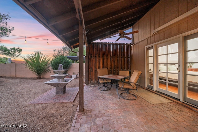 patio terrace at dusk with ceiling fan