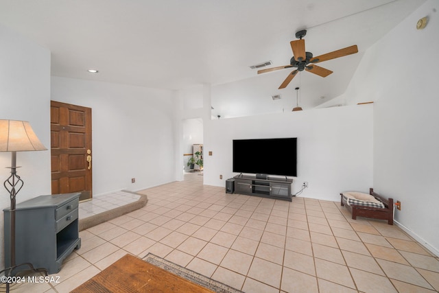 tiled living room with high vaulted ceiling and ceiling fan