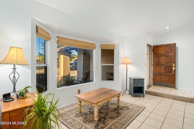 tiled living room featuring lofted ceiling