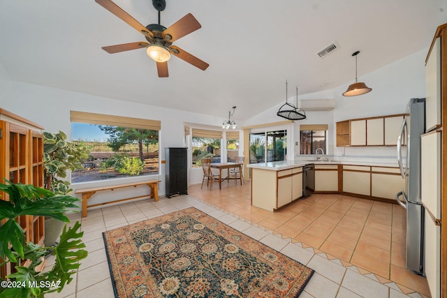 kitchen featuring lofted ceiling, sink, light tile patterned floors, black dishwasher, and kitchen peninsula