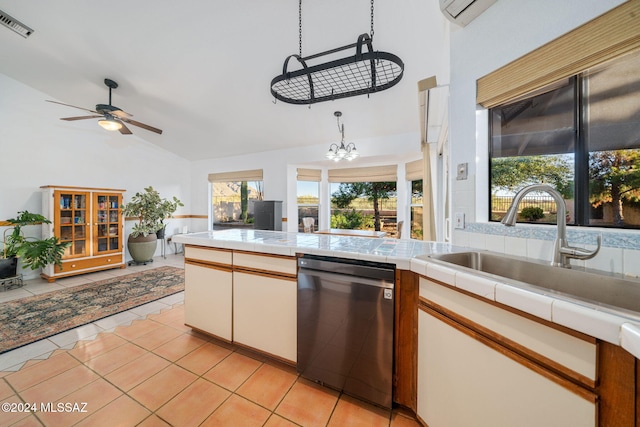 kitchen with white cabinets, sink, tile countertops, dishwasher, and light tile patterned flooring