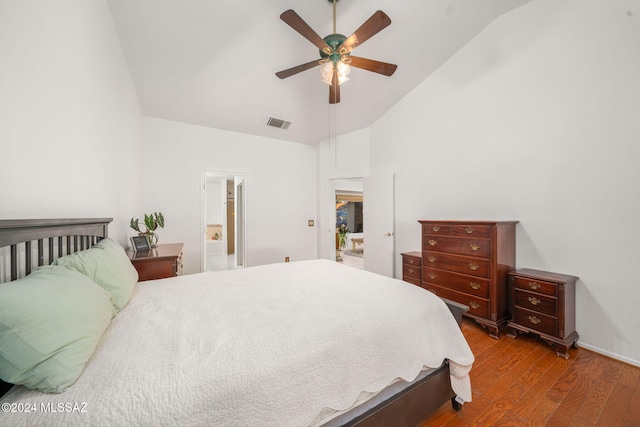 bedroom with wood-type flooring, vaulted ceiling, and ceiling fan