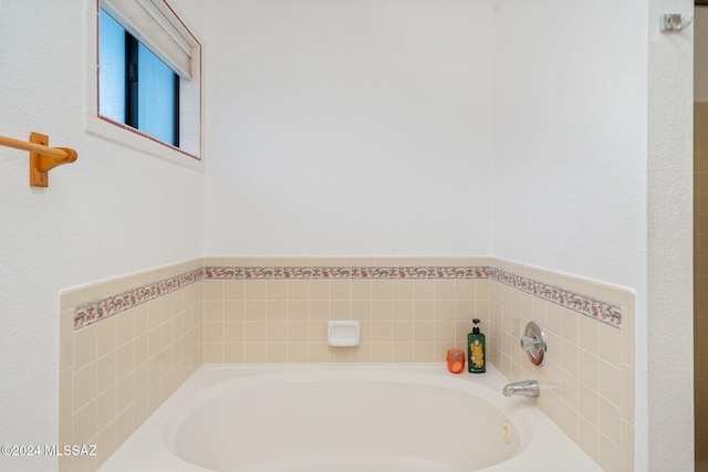 bathroom featuring a tub to relax in