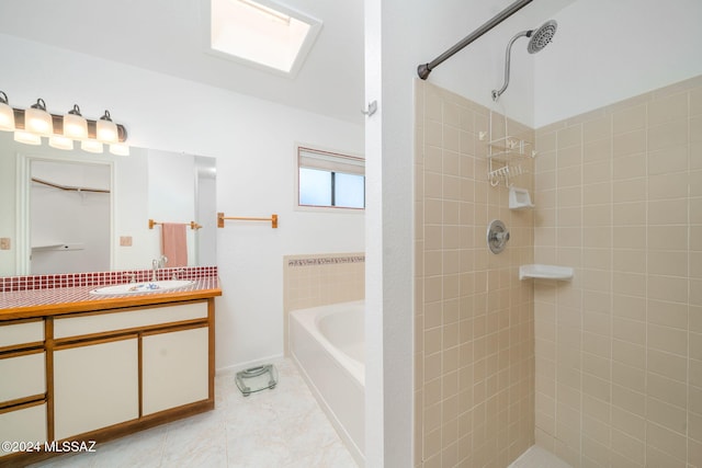 bathroom with tile patterned flooring, vanity, and independent shower and bath