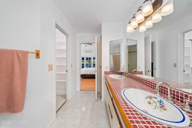 bathroom featuring tile patterned flooring and vanity