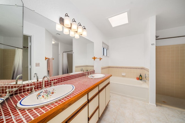 bathroom featuring tile patterned flooring, vanity, and independent shower and bath