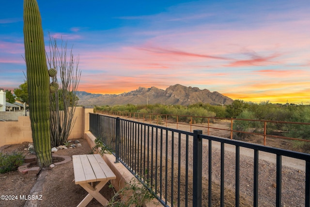 balcony at dusk with a mountain view