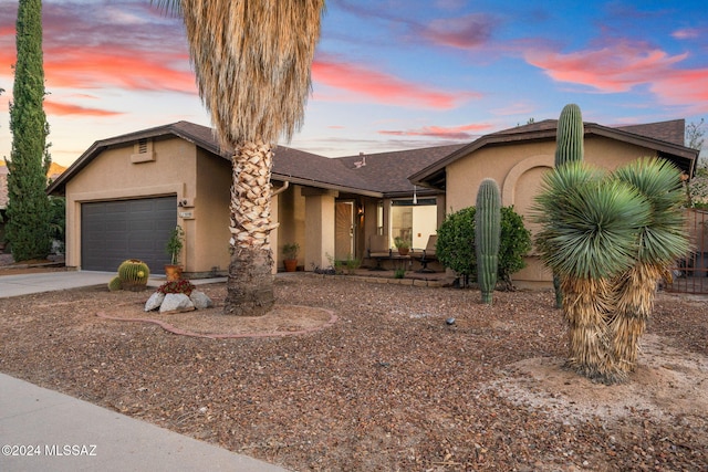 single story home featuring a garage