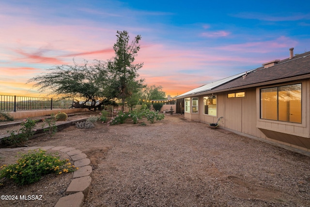 view of yard at dusk