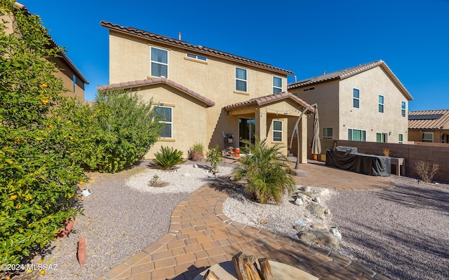 rear view of property with a patio area