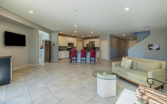 living room featuring light tile patterned floors