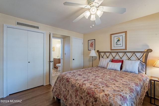 bedroom featuring dark wood-type flooring, connected bathroom, and ceiling fan