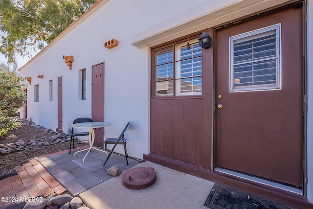 doorway to property featuring a patio