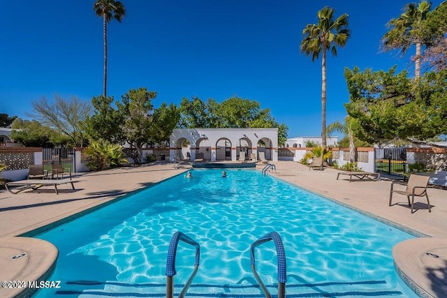 view of pool featuring a patio