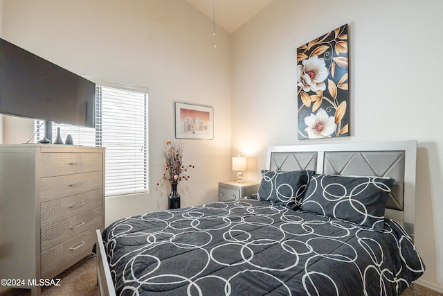 carpeted bedroom featuring vaulted ceiling