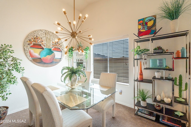 dining area with lofted ceiling, carpet floors, and a notable chandelier