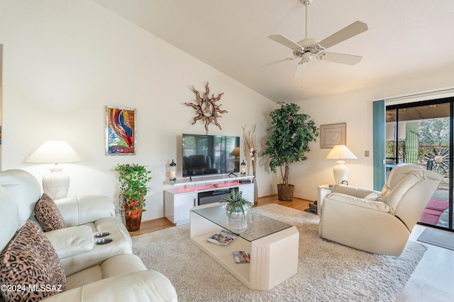 living room with light hardwood / wood-style flooring and ceiling fan