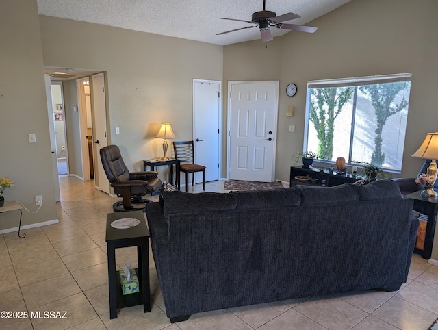 tiled living room with a textured ceiling, ceiling fan, and lofted ceiling