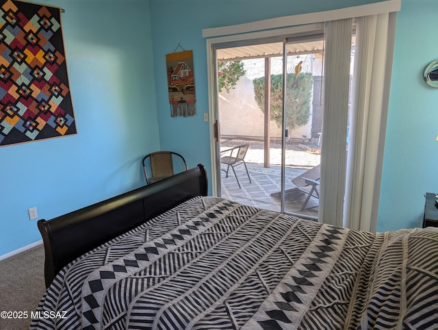 bedroom featuring access to exterior and light carpet