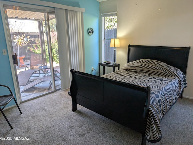 bedroom featuring access to exterior and carpet floors