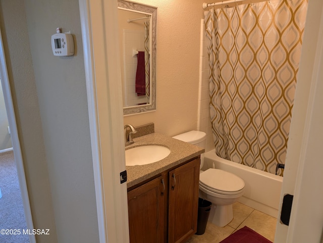 full bathroom featuring tile patterned flooring, vanity, toilet, and shower / tub combo