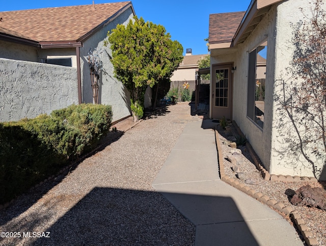 view of side of property with a patio