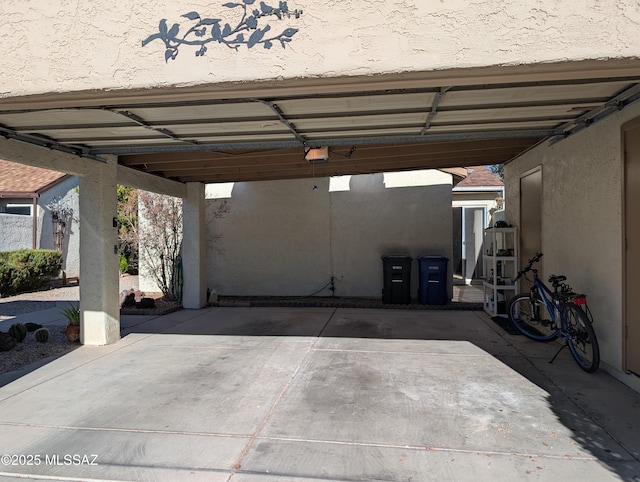 garage featuring a carport and a garage door opener