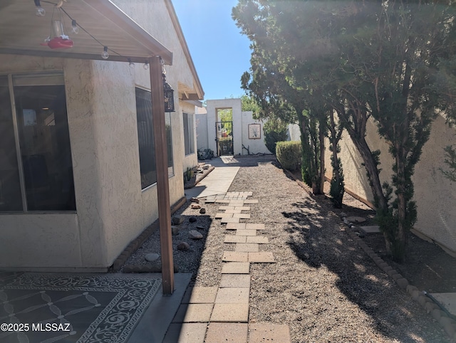 view of side of property with a patio