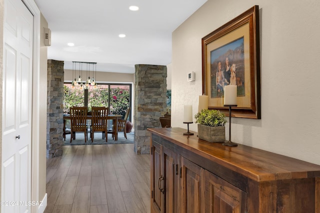 corridor with dark wood finished floors and recessed lighting